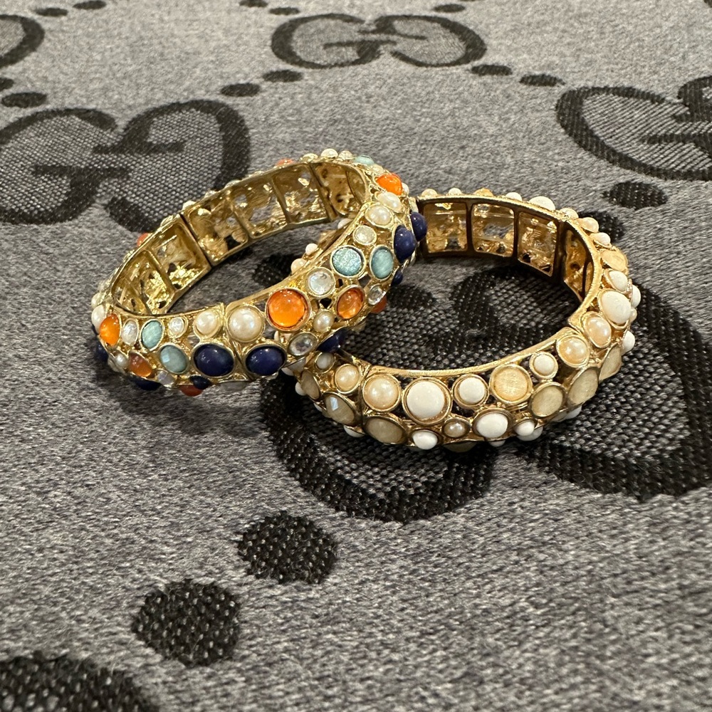 Gold stretchable bangle bracelets with pearls and colorful gems.  Set of…